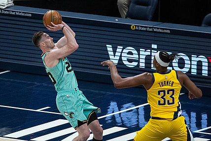 Apr 2, 2021; Indianapolis, Indiana, USA; Charlotte Hornets forward Gordon Hayward (20) shoots the ball while Indiana Pacers center Myles Turner (33) defends in the second quarter at Bankers Life Fieldhouse. Mandatory Credit: Trevor Ruszkowski-USA TODAY Sports
