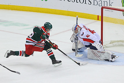 Apr 2, 2021; Newark, New Jersey, USA; Washington Capitals goaltender Vitek Vanecek (41) makes a save on New Jersey Devils center Jack Hughes (86) during overtime at Prudential Center. Mandatory Credit: Ed Mulholland-USA TODAY Sports