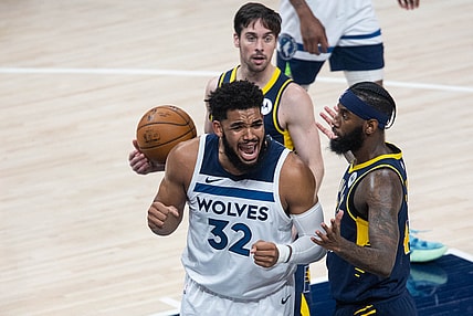 Apr 7, 2021; Indianapolis, Indiana, USA; Minnesota Timberwolves center Karl-Anthony Towns (32) reacts to a foul in the third quarter against the Indiana Pacers at Bankers Life Fieldhouse. Mandatory Credit: Trevor Ruszkowski-USA TODAY Sports