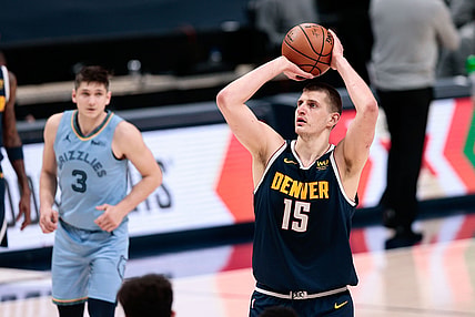 Apr 19, 2021; Denver, Colorado, USA; Denver Nuggets center Nikola Jokic (15) attempts a free throw in the fourth quarter against the Memphis Grizzlies at Ball Arena. Mandatory Credit: Isaiah J. Downing-USA TODAY Sports