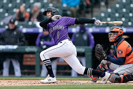 Apr 21, 2021; Denver, Colorado, USA; Colorado Rockies second baseman Garrett Hampson (1) hits a double in the second inning against the Houston Astros at Coors Field. Mandatory Credit: Isaiah J. Downing-USA TODAY Sports
