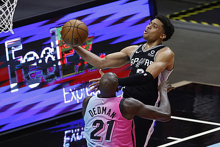 Apr 28, 2021; Miami, Florida, USA;  San Antonio Spurs forward Keldon Johnson (3) shoots around Miami Heat center Dewayne Dedmon (21) during the first half at American Airlines Arena. Mandatory Credit: Rhona Wise-USA TODAY Sports