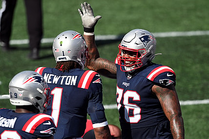Sep 13, 2020; Foxborough, Massachusetts, USA; New England Patriots quarterback Cam Newton (1) celebrates with offensive tackle Isaiah Wynn (76) after scoring a touchdown against the Miami Dolphins during the third quarter at Gillette Stadium. Mandatory Credit: Brian Fluharty-USA TODAY Sports