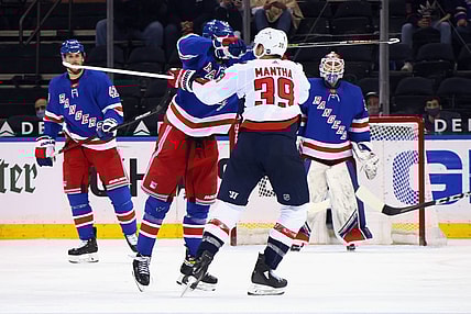 May 5, 2021; New York, New York, USA; Pavel Buchnevich #89 of the New York Rangers takes a high-sticking penalty on Anthony Mantha #39 of the Washington Capitals during the second period at Madison Square Garden. Mandatory Credit:  Bruce Bennett/POOL PHOTOS-USA TODAY Sports