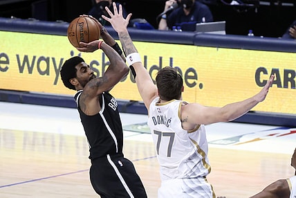 May 6, 2021; Dallas, Texas, USA;  Brooklyn Nets guard Kyrie Irving (11) shoots over Dallas Mavericks guard Luka Doncic (77) during the third quarter at American Airlines Center. Mandatory Credit: Kevin Jairaj-USA TODAY Sports