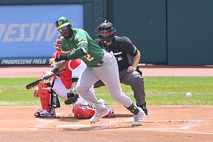 Aug 12, 2021; Cleveland, Ohio, USA; Oakland Athletics center fielder Starling Marte (2) bunts in the first inning against the Cleveland Indians at Progressive Field. Mandatory Credit: David Richard-USA TODAY Sports