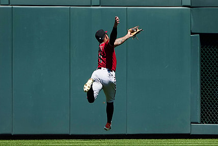 Aug 22, 2021; Denver, Colorado, USA; Arizona Diamondbacks second baseman Ketel Marte (4) fields the ball in the first inning against the Colorado Rockies at Coors Field. Mandatory Credit: Ron Chenoy-USA TODAY Sports