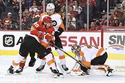 Oct 30, 2021; Calgary, Alberta, CAN; Philadelphia Flyers goalie Carter Hart (79) stops a shot against Calgary Flames forward Blake Coleman (20) during the first period at Scotiabank Saddledome. Mandatory Credit: Candice Ward-USA TODAY Sports