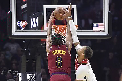 Nov 10, 2021; Cleveland, Ohio, USA; Cleveland Cavaliers forward Lamar Stevens (8) dunks the ball against Washington Wizards center Daniel Gafford (21) in the second quarter at Rocket Mortgage FieldHouse. Mandatory Credit: David Richard-USA TODAY Sports