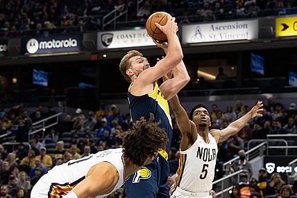 Nov 20, 2021; Indianapolis, Indiana, USA; Indiana Pacers forward Domantas Sabonis (11) shoots the ball and is fouled by New Orleans Pelicans forward Herbert Jones (5) in the first half at Gainbridge Fieldhouse. Mandatory Credit: Trevor Ruszkowski-USA TODAY Sports