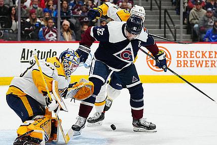 Nov 27, 2021; Denver, Colorado, USA; Nashville Predators goaltender David Rittich (33) and defenseman Mattias Ekholm (14) defend the goal against Colorado Avalanche left wing Gabriel Landeskog (92) in the second period at Ball Arena. Mandatory Credit: Ron Chenoy-USA TODAY Sports