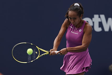 Mar 24, 2022; Miami Gardens, FL, USA; Leylah Fernandez (CAN) hits a backhand against Karolina Muchova (CZE) (not pictured) in a second round women's singles match in the Miami Open at Hard Rock Stadium. Mandatory Credit: Geoff Burke-USA TODAY Sports