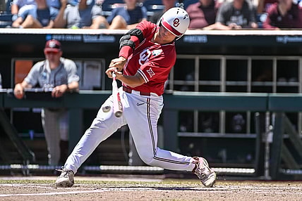 Jun 22, 2022; Omaha, NE, USA; Oklahoma Sooners catcher Jimmy Crooks (3) singles in the third inning against the Texas A&M Aggies at Charles Schwab Field. Mandatory Credit: Steven Branscombe-USA TODAY Sports