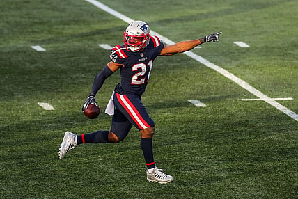 Nov 29, 2020; Foxborough, Massachusetts, USA; New England Patriots saftey Adrian Phillips (21) reacts after intercepting a pass against the Arizona Cardinals during the second half at Gillette Stadium. Mandatory Credit: Paul Rutherford-USA TODAY Sports
