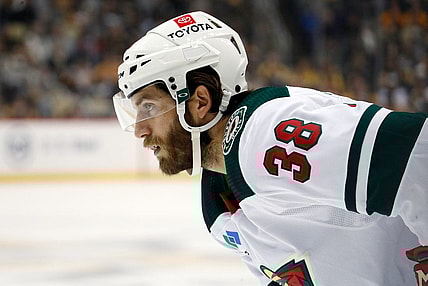 Apr 6, 2023; Pittsburgh, Pennsylvania, USA;  Minnesota Wild right wing Ryan Hartman (38) looks on at the face-off circle against the Pittsburgh Penguins during the first period at PPG Paints Arena. Mandatory Credit: Charles LeClaire-USA TODAY Sports