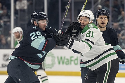 May 7, 2023; Seattle, Washington, USA; Seattle Kraken defenseman Vince Dunn (29) and Dallas Stars forward Jason Robertson (21) shove one another during the first period in game three of the second round of the 2023 Stanley Cup Playoffs at Climate Pledge Arena. Mandatory Credit: Stephen Brashear-USA TODAY Sports