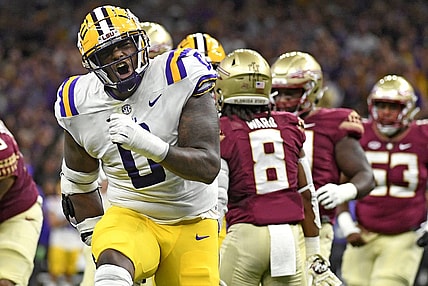 Sep 4, 2022; New Orleans, Louisiana, USA; Louisiana State Tigers defensive tackle Maason Smith (0) celebrates a play during the first half against the Florida State Seminoles at Caesars Superdome. Mandatory Credit: Melina Myers-USA TODAY Sports