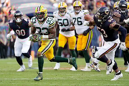 Green Bay Packers running back Aaron Jones (33) runs for a touchdown during second half of their game against the Chicago Bears on Sunday, Sept. 10, 2023 at Soldier Field in Chicago.