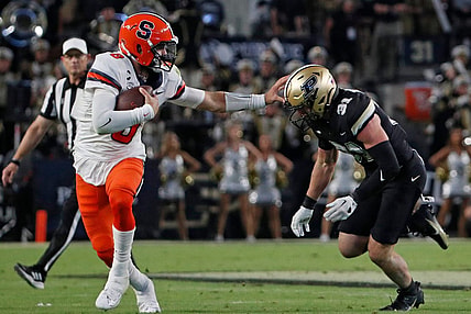Syracuse Orange quarterback Garrett Shrader (6) stiff arms Purdue Boilermakers defensive back Dillon Thieneman (31) during the NCAA football game, Saturday, Sept. 16, 2023, at Ross-Ade Stadium in West Lafayette, Ind. Syracuse Orange won 35-20.