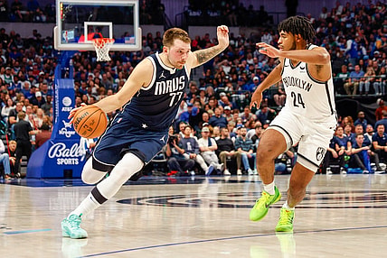 Oct 27, 2023; Dallas, Texas, USA; Dallas Mavericks guard Luka Doncic (77) drives on Brooklyn Nets guard Cam Thomas (24) during the second quarter at American Airlines Center. Mandatory Credit: Andrew Dieb-USA TODAY Sports