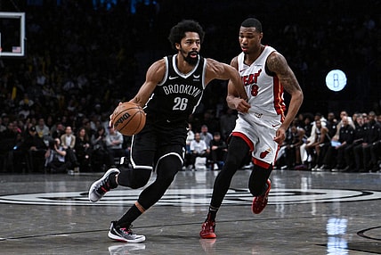 Nov 25, 2023; Brooklyn, New York, USA; Brooklyn Nets guard Spencer Dinwiddie (26) drives against Miami Heat forward Jamal Cain (8) during the fourth quarter at Barclays Center. Mandatory Credit: John Jones-USA TODAY Sports