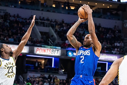 Dec 18, 2023; Indianapolis, Indiana, USA; LA Clippers forward Kawhi Leonard (2) shoots the ball while Indiana Pacers forward Aaron Nesmith (23) defends in the first quarter at Gainbridge Fieldhouse. Mandatory Credit: Trevor Ruszkowski-USA TODAY Sports
