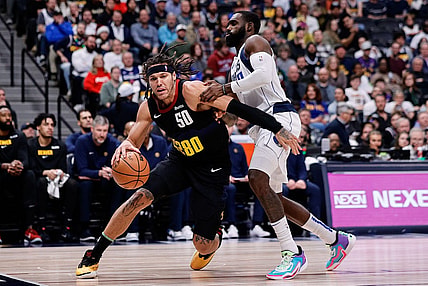 Dec 18, 2023; Denver, Colorado, USA; Denver Nuggets forward Aaron Gordon (50) controls the ball as Dallas Mavericks forward Tim Hardaway Jr. (10) guards in the second quarter at Ball Arena. Mandatory Credit: Isaiah J. Downing-USA TODAY Sports