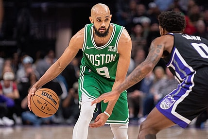 Dec 20, 2023; Sacramento, California, USA; Boston Celtics guard Derrick White (9) controls the ball against Sacramento Kings guard Malik Monk (0) during the fourth quarter at Golden 1 Center. Mandatory Credit: Ed Szczepanski-USA TODAY Sports