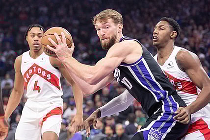 Jan 5, 2024; Sacramento, California, USA; Sacramento Kings forward Domantas Sabonis (10) controls the ball against the Toronto Raptors during the first quarter at Golden 1 Center. Mandatory Credit: Ed Szczepanski-USA TODAY Sports