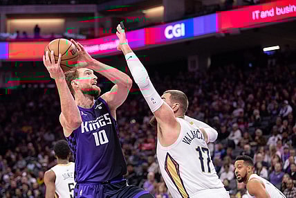 Jan 7, 2024; Sacramento, California, USA; Sacramento Kings forward Domantas Sabonis (10) controls the ball against New Orleans Pelicans center Jonas Valanciunas (17) during the first quarter at Golden 1 Center. Mandatory Credit: Ed Szczepanski-USA TODAY Sports