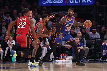 Jan 27, 2024; New York, New York, USA; New York Knicks forward Julius Randle (30) controls the ball as Miami Heat forward Haywood Highsmith (24) and forward Jimmy Butler (22) defend during the first half at Madison Square Garden. Mandatory Credit: Vincent Carchietta-USA TODAY Sports