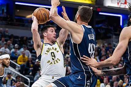 Feb 25, 2024; Indianapolis, Indiana, USA; Indiana Pacers guard T.J. McConnell (9) passes the ball while Dallas Mavericks forward Maxi Kleber (42) defends in the first half at Gainbridge Fieldhouse. Mandatory Credit: Trevor Ruszkowski-USA TODAY Sports