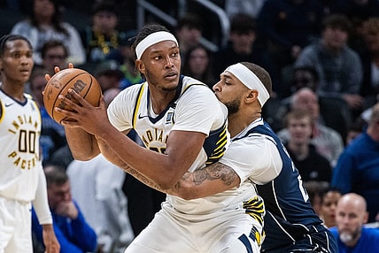 Feb 25, 2024; Indianapolis, Indiana, USA; Indiana Pacers center Myles Turner (33) holds the ball while Dallas Mavericks center Daniel Gafford (21) defends in the second half at Gainbridge Fieldhouse. Mandatory Credit: Trevor Ruszkowski-USA TODAY Sports