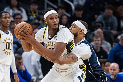 Feb 25, 2024; Indianapolis, Indiana, USA; Indiana Pacers center Myles Turner (33) holds the ball while Dallas Mavericks center Daniel Gafford (21) defends in the second half at Gainbridge Fieldhouse. Mandatory Credit: Trevor Ruszkowski-USA TODAY Sports