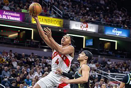 Feb 26, 2024; Indianapolis, Indiana, USA; Toronto Raptors forward Scottie Barnes (4) shoots the ball while Indiana Pacers guard Andrew Nembhard (2) defends in the first half at Gainbridge Fieldhouse. Mandatory Credit: Trevor Ruszkowski-USA TODAY Sports