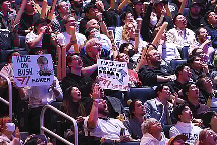 Nov 5, 2022; San Francisco, California, USA; Fans hold signs for T1 mid laner Lee "Faker" Sang-hyeok (not pictured) during the League of Legends World Championships against DRX at Chase Center. Mandatory Credit: Kelley L Cox-USA TODAY Sports