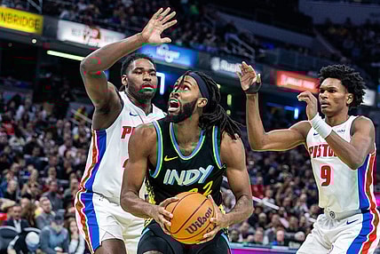 Nov 24, 2023; Indianapolis, Indiana, USA; Indiana Pacers forward Isaiah Jackson (22) shoots the ball while Detroit Pistons center Isaiah Stewart (28) and forward Ausar Thompson (9) defend in the second half at Gainbridge Fieldhouse. Mandatory Credit: Trevor Ruszkowski-USA TODAY Sports
