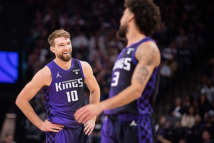 Mar 4, 2024; Sacramento, California, USA; Sacramento Kings forward Domantas Sabonis (10) smiles at guard Chris Duarte (3) during the second quarter at Golden 1 Center. Mandatory Credit: Ed Szczepanski-USA TODAY Sports