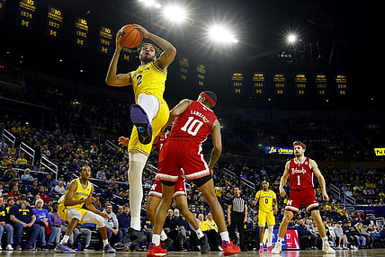 Mar 10, 2024; Ann Arbor, Michigan, USA;  Michigan Wolverines forward Tray Jackson (2) grabs the rebound over Nebraska Cornhuskers guard Jamarques Lawrence (10) in the first half at Crisler Center. Mandatory Credit: Rick Osentoski-USA TODAY Sports