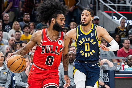 Mar 13, 2024; Indianapolis, Indiana, USA; Chicago Bulls guard Coby White (0) dribbles the ball while Indiana Pacers guard Tyrese Haliburton (0) defends in the first half at Gainbridge Fieldhouse. Mandatory Credit: Trevor Ruszkowski-USA TODAY Sports