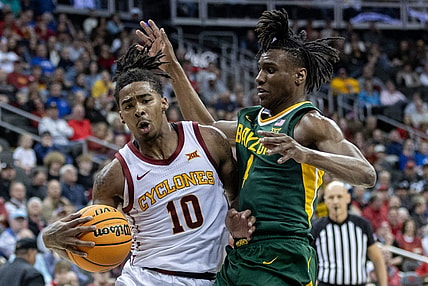 Mar 15, 2024; Kansas City, MO, USA; Iowa State Cyclones guard Keshon Gilbert (10) drives around Baylor Bears guard Ja'Kobe Walter (4) during the first half at T-Mobile Center. Mandatory Credit: William Purnell-USA TODAY Sports