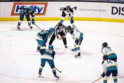 New York Sirens forward Sarah Fillier and Seattle Torrent forward Alex Carpenter take a faceoff in Chicago.