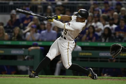Jul 17, 2021; Pittsburgh, Pennsylvania, USA;  Pittsburgh Pirates pinch hitter Wilmer Difo (15) hits a three run pinch hit home run against the New York Mets during the eighth inning at PNC Park. Mandatory Credit: Charles LeClaire-USA TODAY Sports
