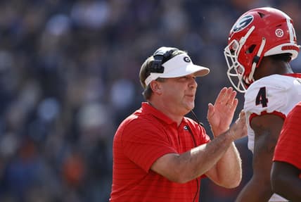 Oct 9, 2021; Auburn, Alabama, USA; Georgia Bulldogs head coach Kirby Smart talks to Georgia Bulldogs linebacker Nolan Smith (4) during the first quarter against the Auburn Tigers at Jordan-Hare Stadium. Mandatory Credit: John Reed-USA TODAY Sports