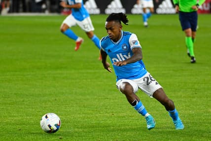 Feb 26, 2022; Washington, District of Columbia, USA; Charlotte FC forward Yordy Reyna (26) controls the ball against the D.C. United during the game at Audi Field. Mandatory Credit: Brad Mills-USA TODAY Sports