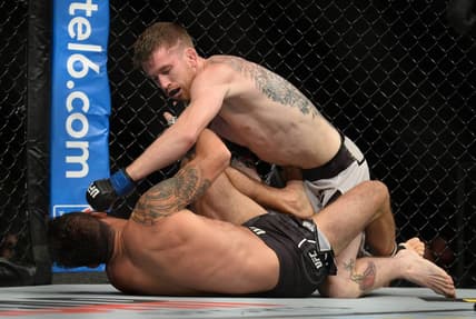 August 17, 2019; Anaheim, CA, USA; Cory Sandhegen lands a hit against Raphael Assuncao during UFC 241 at Honda Center. Mandatory Credit: Gary A. Vasquez-USA TODAY Sports