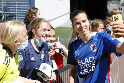 Aug 14, 2022; Seattle, Washington, USA; OL Reign forward Tobin Heath (77) reacts with fans after the game against the NJ/NY Gotham FC at Lumen Field. Mandatory Credit: Joe Nicholson-USA TODAY Sports
