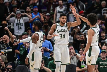 Nov 2, 2022; Milwaukee, Wisconsin, USA;  Milwaukee Bucks forward Giannis Antetokounmpo (34) celebrates with forward Jordan Nwora (13) after scoring a basket in the third quarter against the Detroit Pistons at Fiserv Forum. Mandatory Credit: Benny Sieu-USA TODAY Sports