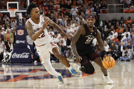 Jan 25, 2023; Auburn, Alabama, USA;  Texas A&M Aggies guard Tyrece Radford (23) drives past Auburn Tigers guard Allen Flanigan (22) during the first half at Neville Arena. Mandatory Credit: John Reed-USA TODAY Sports