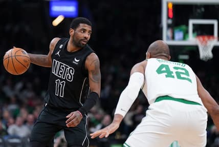 Feb 1, 2023; Boston, Massachusetts, USA; Brooklyn Nets guard Kyrie Irving (11) returns the ball against Boston Celtics center Al Horford (42) in the second half at TD Garden. Mandatory Credit: David Butler II-USA TODAY Sports